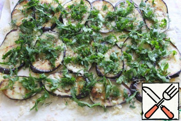 On eggplant chopped greens.