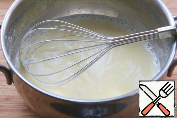 In a thick-bottomed saucepan, pour in the milk, add the sugar, pour in the pudding and stir well with a whisk.
Put on the fire and, constantly stirring, bring to a boil.
Remove from the heat and cool to warm - put the pan in a container with cold water.