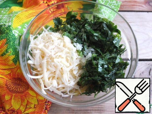 Add the grated cheese, garlic, and finely chopped herbs passed through the press. I took dill, coriander and parsley.