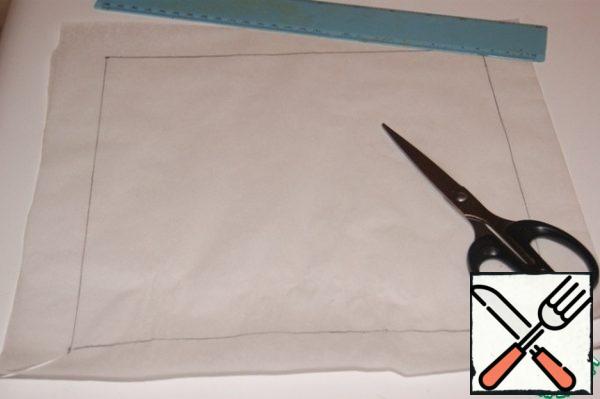 For baking sponge cake we will need a form with a size of 25x25 cm
I don't have a mold this size, so I used a split frame, inserting a "mold" from baking paper into it.
On a sheet of baking paper, draw a square of 25x25 cm, making allowances for the edges of 3 cm, which are bent along the drawn lines