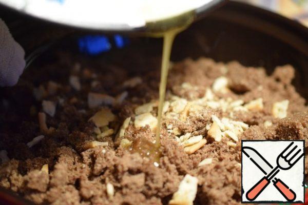 Melt the butter and pour into the bread, knead with your hands or a spoon.