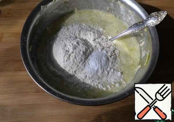 Add the flour with baking powder and mix.