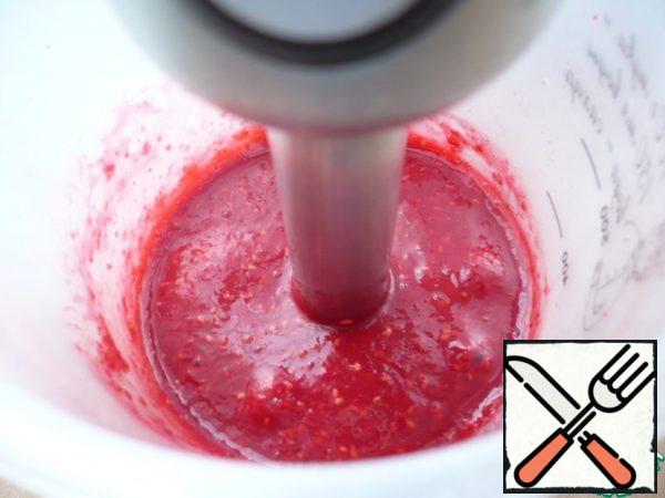 Raspberries are crushed with a blender.