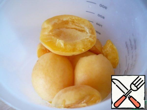 Remove the seeds from the apricot and put them in a bowl for chopping.