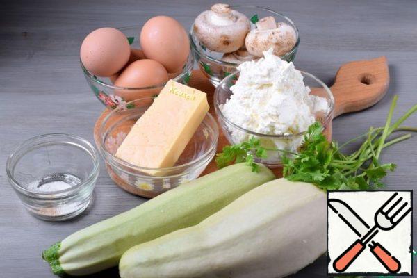 Prepare the products.
Will need two young zucchini, preferably one vegetable with a small diameter.
Let's take the cheese that is in the refrigerator.
Greens - to taste.
For a more piquant taste, you can add a clove of garlic to the filling.