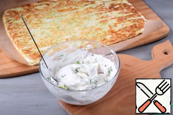 Bake the base for about 20 minutes or until fully cooked. Cool the resulting layer in the form a little, and then tip it over on a clean parchment so that the pattern is at the bottom.
For the filling, mix cottage cheese, chopped herbs, salt and spices.