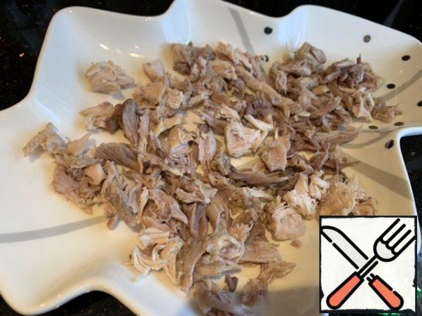 Separate all the bones from the rabbit and cut the fillet into strips. Put in a mold for aspic.