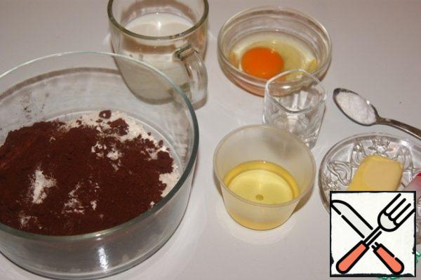 In this recipe, we cook everything without a mixer!
Truffle sponge cake is baked 1 day before the preparation of the cake.

All products for the biscuit must be at room temperature.
Sift together the flour, cocoa, vanilla, baking soda and baking powder. Add the sugar and stir.