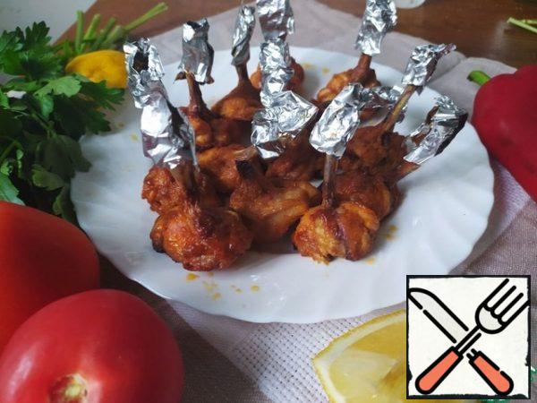 Bake the wings in a preheated 200-degree oven until they are nicely browned.