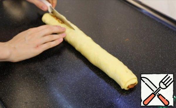 I turn into a not tight roll, cut along the length not reaching one edge of a couple of centimeters.