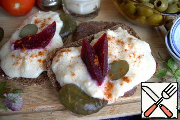 And a pickle. In the cheese itself or on top, you can add paprika and a little chili pepper.