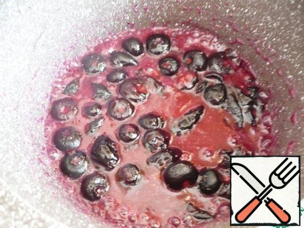 To make the blueberry filling: mix the sugar and cornstarch together with the blueberries in a small saucepan and cover everything with water. Mix well and set to cook over medium heat until the mixture begins to bubble and thicken.