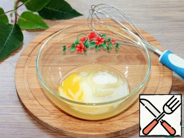 In a separate bowl, whisk the egg with vanilla and regular sugar...