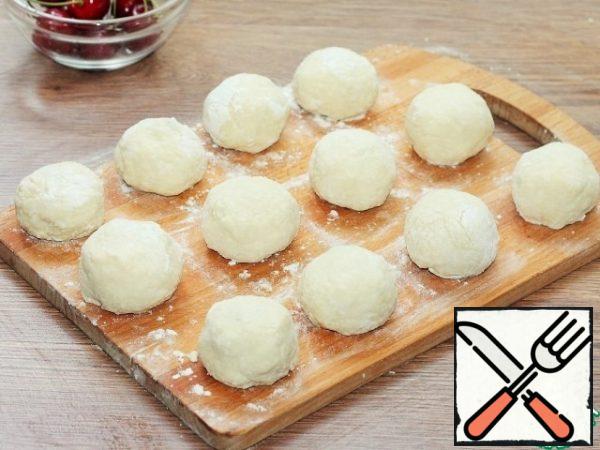 Again roll into balls that are already stuffed. Lower the dumplings into boiling, sweet water and cook for 30 minutes over low heat. Dumplings should increase by 1.5 times due to semolina.
