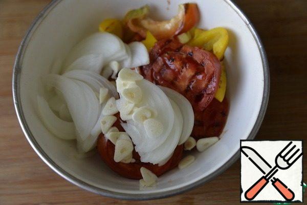 Add chopped onion and garlic to the hot grilled vegetables.