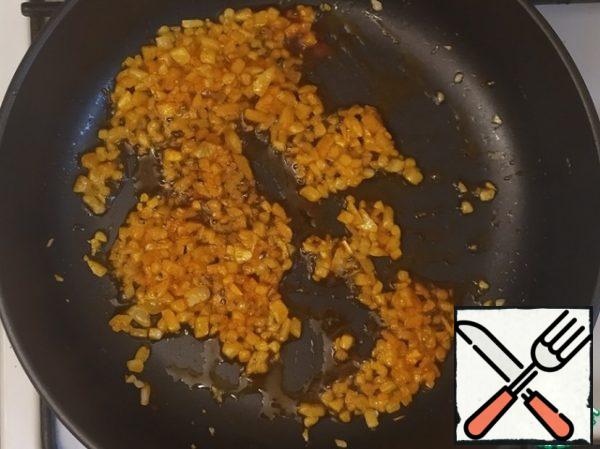 After five minutes, add the paprika and fry.