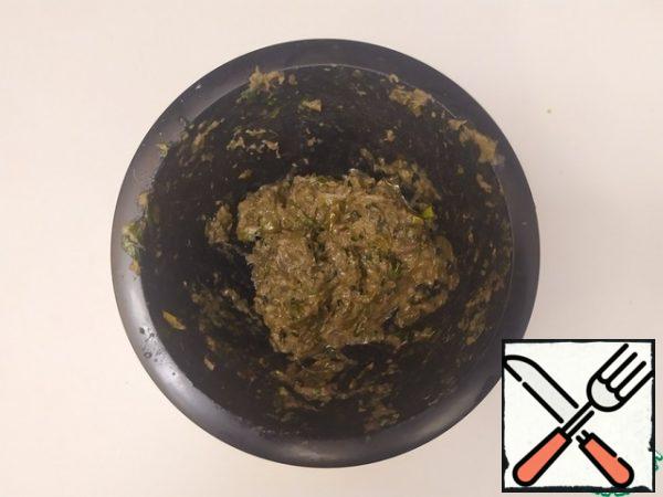 Pound until smooth. Add lemon juice, 2 tablespoons of olive oil, salt and pepper. And mix.