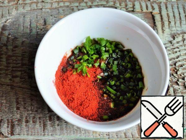 Prepare the sauce.
In a bowl, mix ground garlic, red pepper,
chopped green onions, sugar and soy sauce. Set aside.