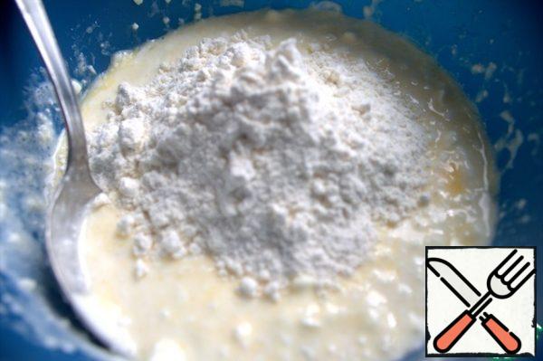 Add the sifted flour.