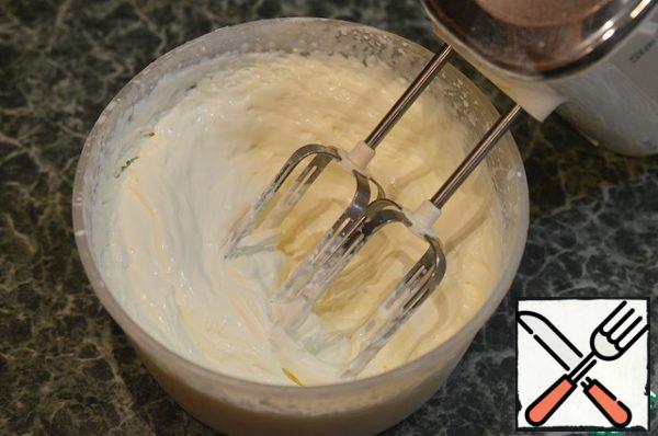 Beat the cream on a medium speed mixer until soft peaks form.