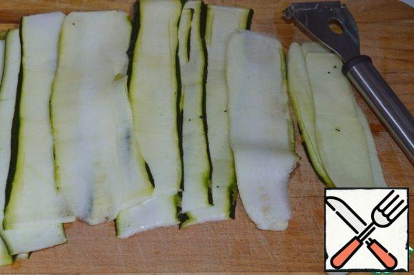 Zucchini cut into thin strips in a convenient way.