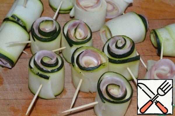 Roll into a tight roll and stab with a toothpick or skewer.