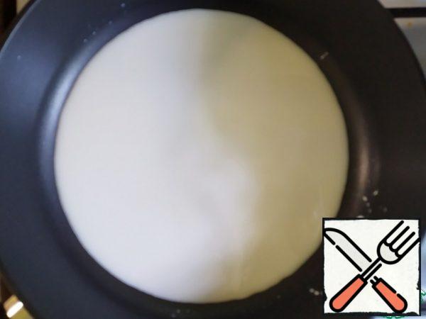 Pour cream into a frying pan, add zest.  Cook for 3-4 minutes, stirring frequently.