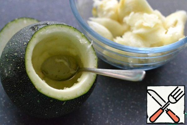 Use a spoon to pick out the middle of the zucchini.  Cut in small pieces.