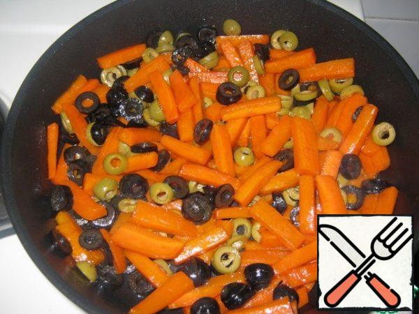 Add olives to carrots and heat for 1-2 minutes, remove from heat.
