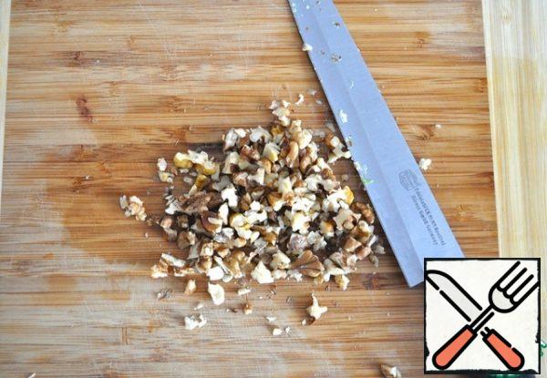 Grind the walnuts.
