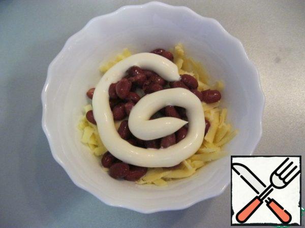 Layer 3: beans and mayonnaise.