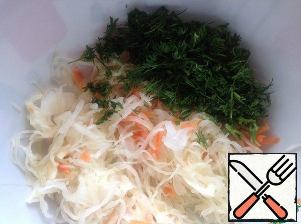 Put Sauerkraut in a salad bowl, squeezing out excess liquid.  Chop the dill finely.