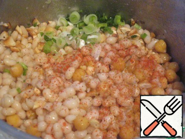 Combine beans, chickpeas, chopped greens, chopped garlic and nuts (can be substituted with walnuts or added with cashews).  Add spices to taste.