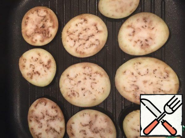 Slice and salt the eggplant.  Fry on 2 sides in a grill pan (grilled open, on any type of grill available to you)))