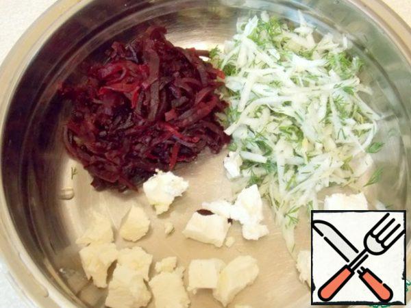 Peel the daikon and grate it on a coarse grater.  Finely chop the greens and mix.  Cut the cheese into small cubes.