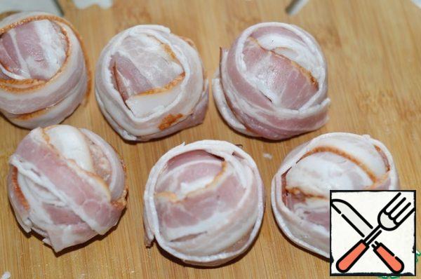 Wrap strips of bacon.