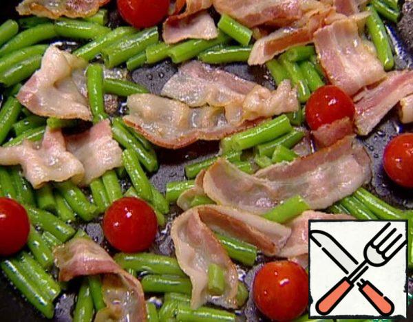Add the cherry tomatoes and continue to fry.