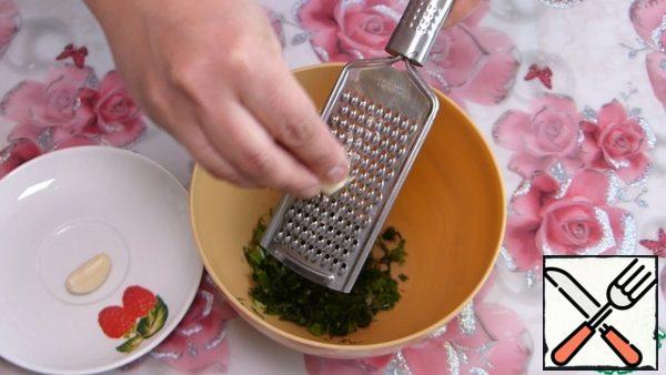 Chop 2 cloves of garlic. Add to the greens.