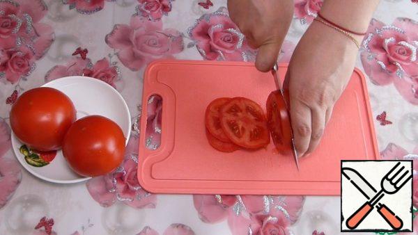 Tomatoes cut into circles.