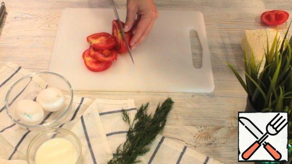 Next, cut 2 circles of tomatoes. Cut the dill, you will need just a couple of twigs.