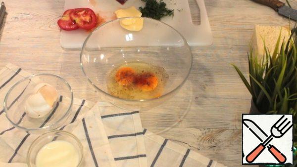 In a bowl, break the eggs, salt, pepper, add your favorite spices (I add sweet paprika). Add milk to the egg mixture and shake well with a whisk.