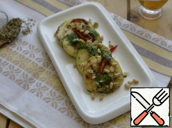 Serve the appetizer chilled, sprinkle with fried pine nuts when serving.