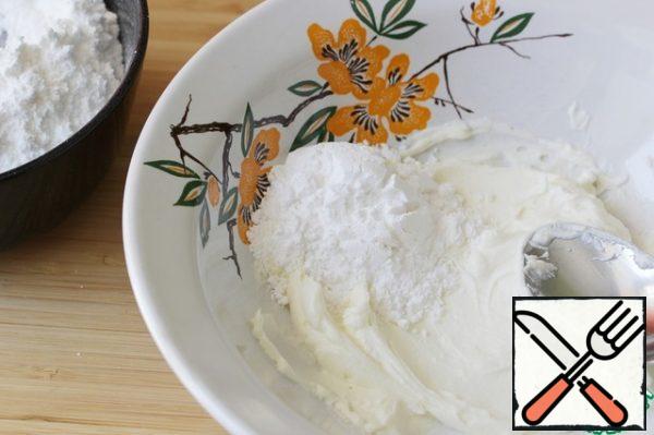 Continuing to RUB, in several steps, add powdered sugar in small portions.