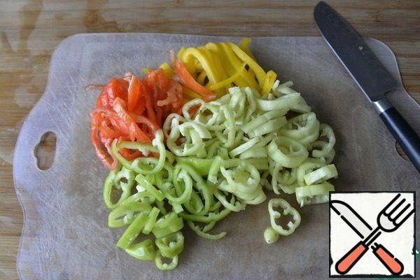 Peppers are washed, cleaned from seeds. Cut into half-rings, rings or strips depending on the size.
I have an assortment of red, yellow, local "white" and hot green pepper.