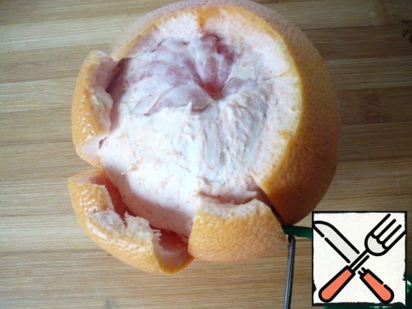 Pull out all the pulp from the inside (be sure to remove the white membrane it is bitter).