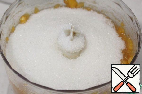 Chop the apricots using a blender.
Add sugar.