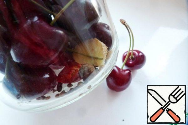 Put the spices in a jar (or other suitable container), then fill it with cherries.