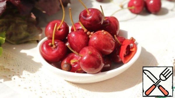 Serve pickled cherries as an appetizer with cheese and wine. This cherry looks spectacular as a decoration for baked meat or poultry.