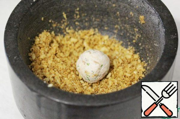 Roll the balls in the nut breadcrumbs.