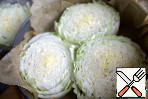 Cut into thick washers (the same height is desirable), transfer to a form with parchment, try not to lose the side leaves.